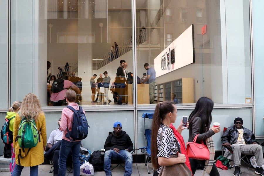 Loyal Apple Customers waiting outside Apple stores in New York to buy the new Apple X