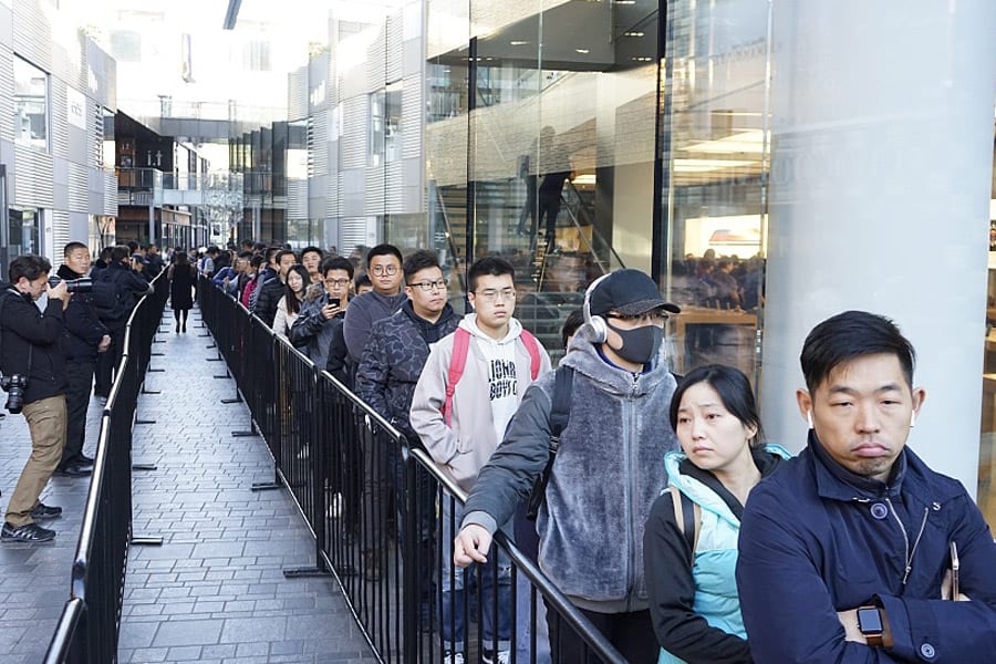 Loyal Apple Customers waiting outside Apple stores in Beijing to buy the new Apple X