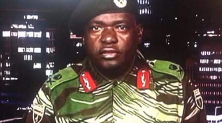 Zimbabwe Major General Sibusiso Moyo reading a statement at the ZBC broadcast studio in Harare. Zimbabwe's military appeared to be in control of the country on November 15 as generals denied staging a coup but used state television to vow to target "criminals" close to President Robert Mugabe