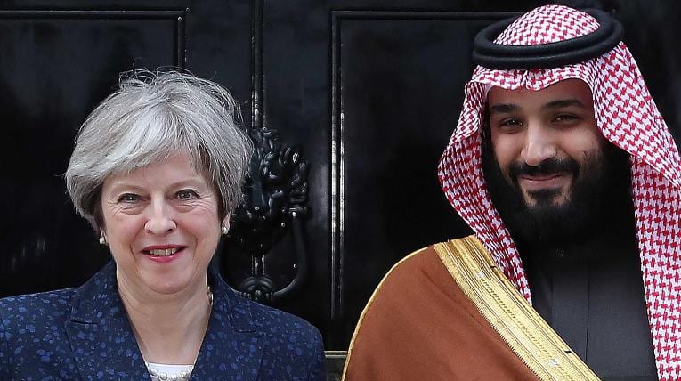Britain's Prime Minister Theresa May (L) greets Saudi Arabia's Crown Prince Mohammed bin Salman