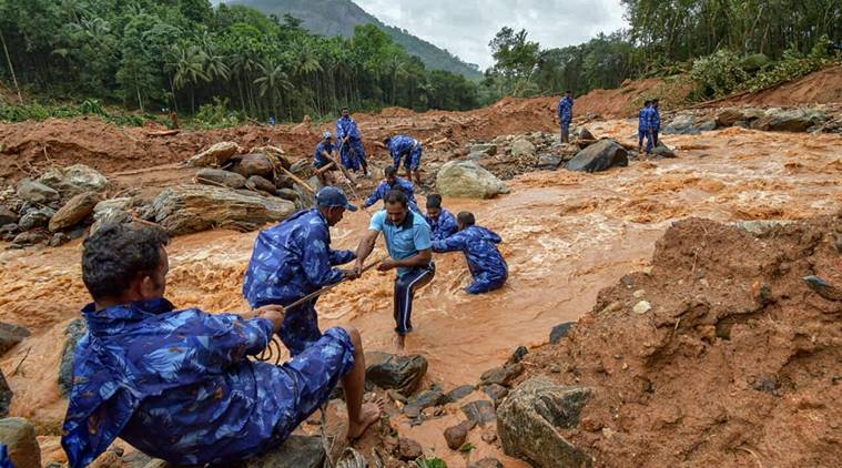 Kerala: Rescue workers search for the bodies of missing persons after a landslide, triggered by heavy rains and floods