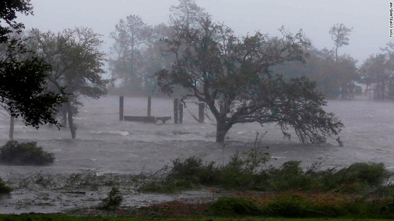 More than 20,000 residents have packed into North Carolina emergency shelters, and officials have told those still in the storm's path to stay in place.