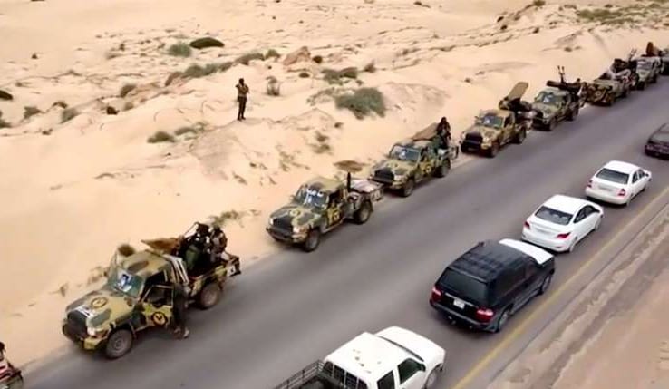 An aerial view shows military vehicles on a road in Libya