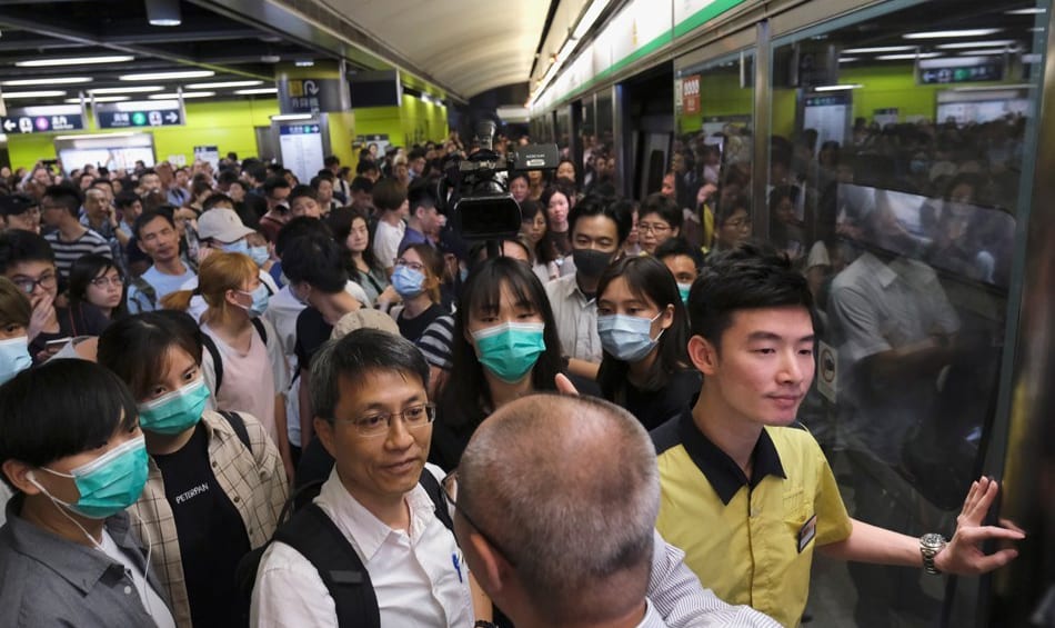 Hong Kong protesters disrupt commuters and delay employees getting to work