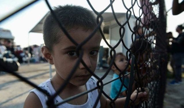 Greek police fire tear gas at migrant children