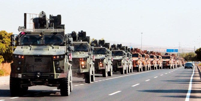 A Turkish military convoy is pictured in Kilis near the Turkish-Syrian border, as Ankara launches Operation Peace Spring in northern Syria on Wednesday afternoon.