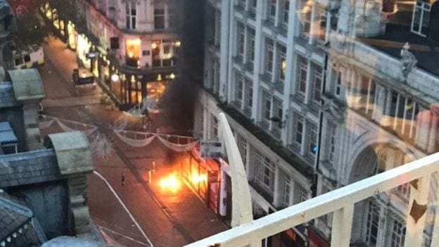 Part of a busy city centre street has been cordoned off after an underground fire reached above the surface in big flashes of flame.
