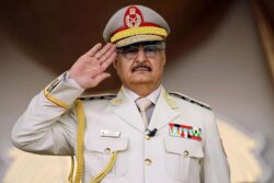 Libyan Khalifa Haftar salutes during a military parade in Benghazi