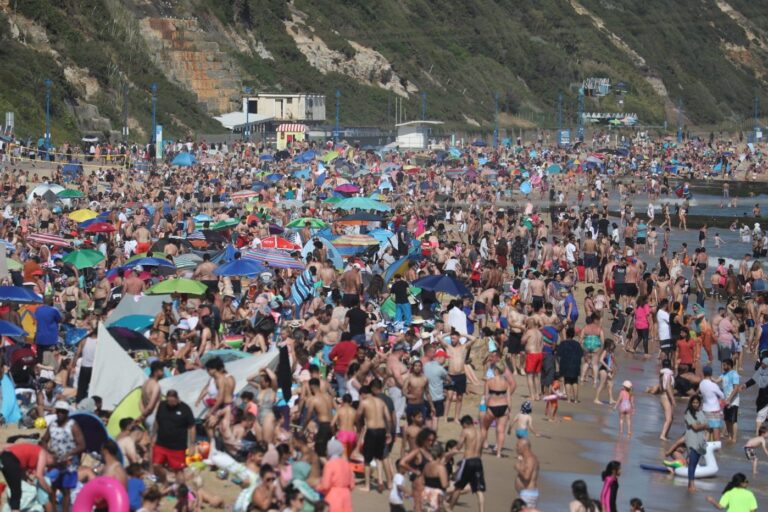 Major incident declared as people flock to England’s south coast, Hancock warns he could close beaches
