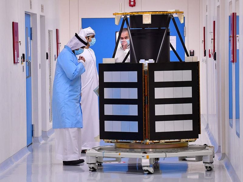 UAE space mission -Engineers observe a KhalifaSat model at the Mohammed Bin Rashid Space Centre (MBRSC), in dubai. Only the United States, India, the former Soviet Union, and the European Space Agency have successfully sent missions to orbit the Red Planet, while China is preparing to launch its first Mars rover later this month.