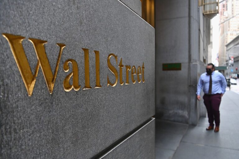 Wall Street stumbles on halted Covid vaccines, US stimulus delays