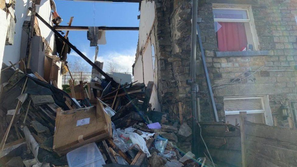 House explosions kills a 79-year-old woman and leaves two injured