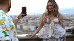 In the middle of a cyberbullying scandal, the embattled model puts her worries aside as she and her husband John Legend tour Florence with their children.