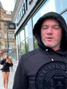 Wayne Rooney filmed walking two blondes back to budget hotel