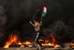 Dozens hurt as Israel raids Gaza, fires at Palestinian protesters