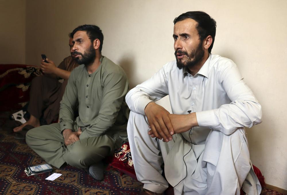 The survivors of the killed Afghan family - Romal Ahmadi, right, speaks during an interview - during a U.S. drone strike in Kabul, Afghanistan