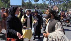 Women in rare protest as Taliban outline new government