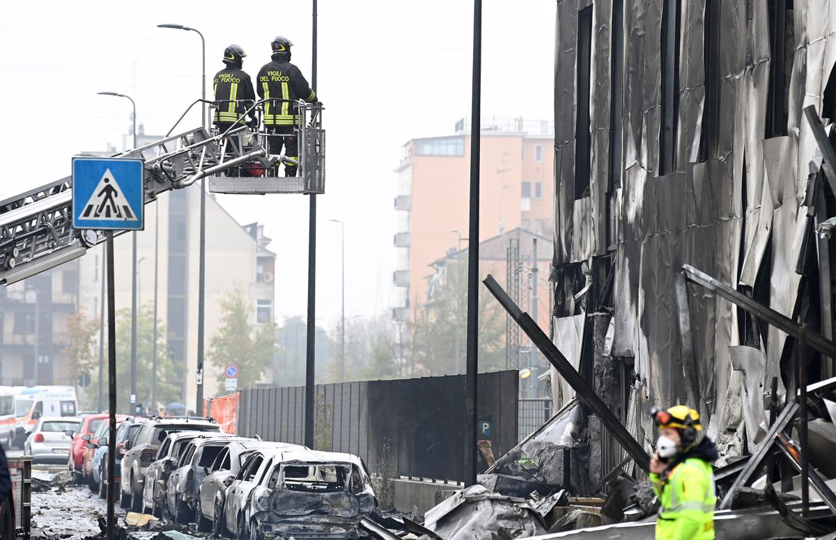 Small plane crashes into empty building outside Milan, all 8 onboard die