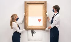‘Legendary piece!’ Banksy’s shredded Girl With Balloon sells at auction for £18.6m