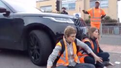 Dramatic moment furious motorist in Range Rover drives into Insulate Britain protesters blocking the road