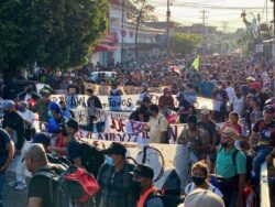 Thousands of migrants march from Mexican city and push past blockade towards US