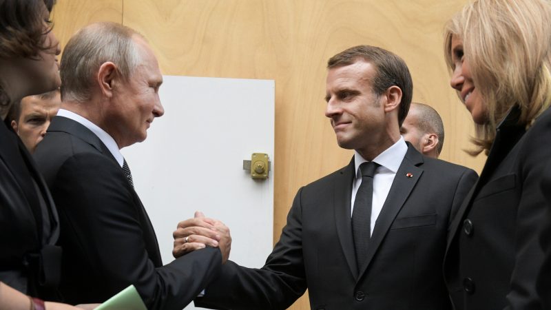 Macron and Putin shake hands as the EU signals ceasefire with Russia in Paris peace talks