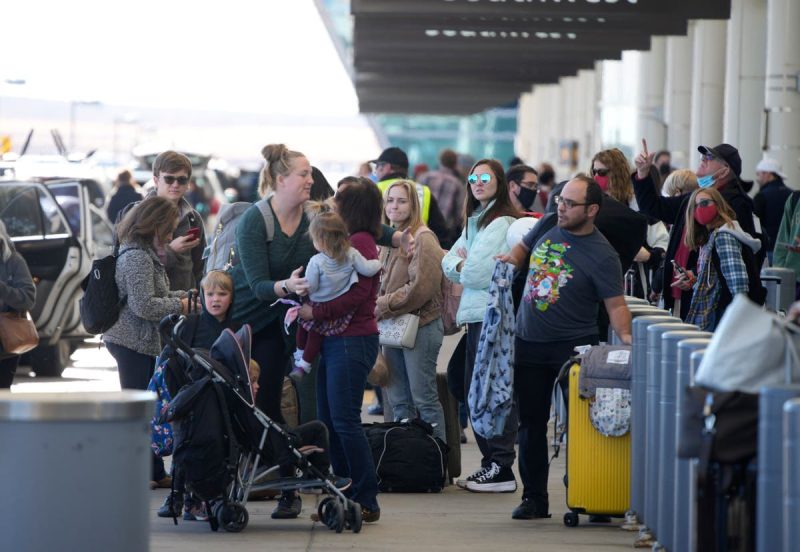 2,400 US flights cancelled as Omicron and bad weather cause travel chaos