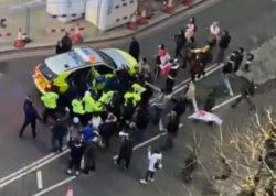 Sir Keir Starmer bundled into back of police car after being mobbed by protesters shouting ‘Jimmy Savile’ at Labour leader