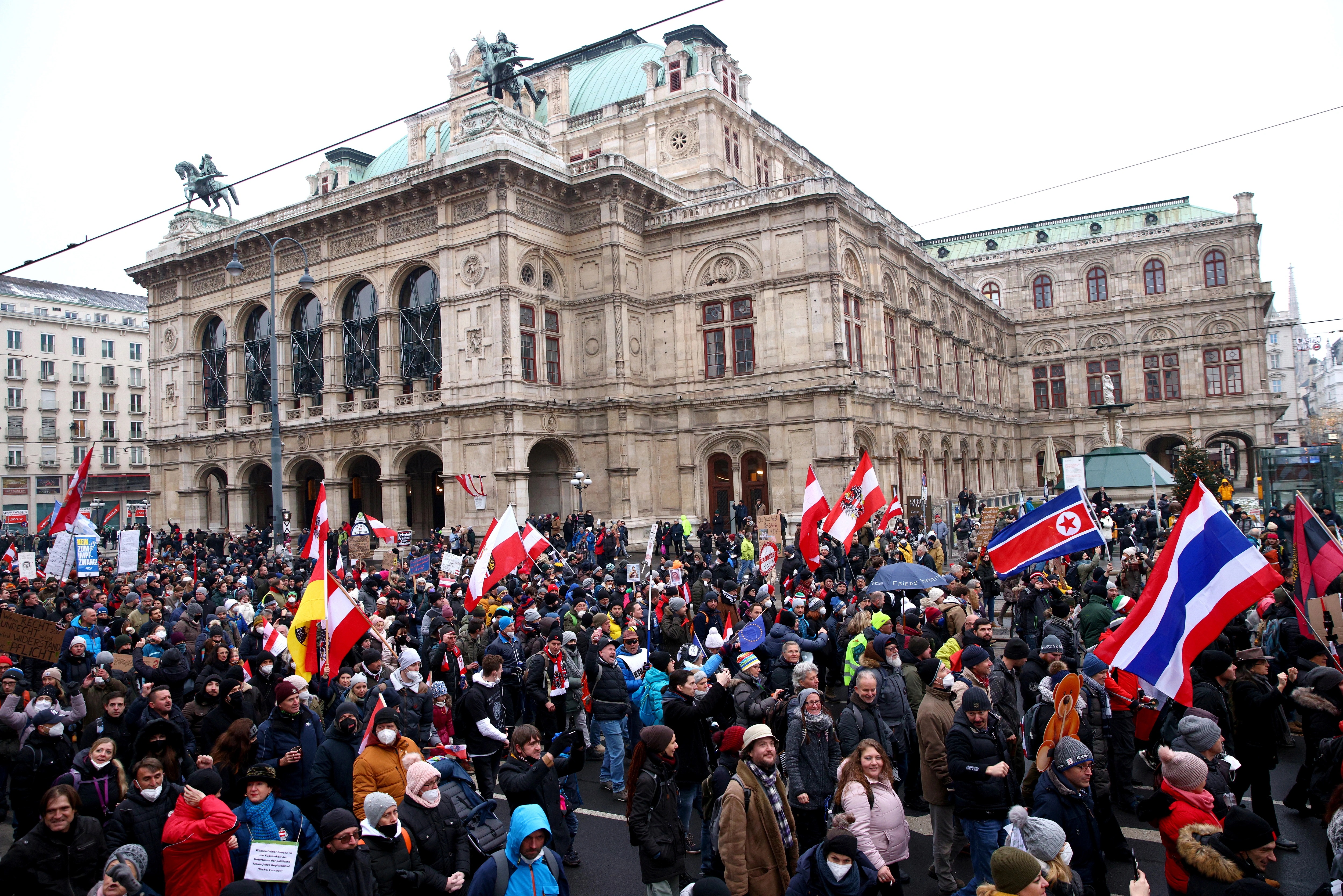 Tens of thousands of people have rallied in Vienna in protest against restrictions introduced to halt the spread of coronavirus in Austria, including mandatory COVID-19 vaccines and home confinement orders for the unvaccinated. About 1,400 police officers were on duty on Saturday to oversee the protest, which attracted an estimated 44,000 people and followed a similar demonstration in the Austrian capital last week. Police said three people were arrested for offences including the use of fireworks and disregarding the requirement to wear masks. Journalists covering the event, which began in Heldenplatz square, were attacked with snowballs and ice, and one reporter was the victim of an attempted assault, police said.