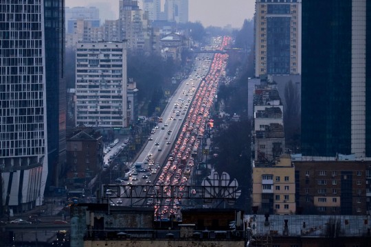 Thousands flee Kyiv in panic after Russia bombs Ukraine and invades country