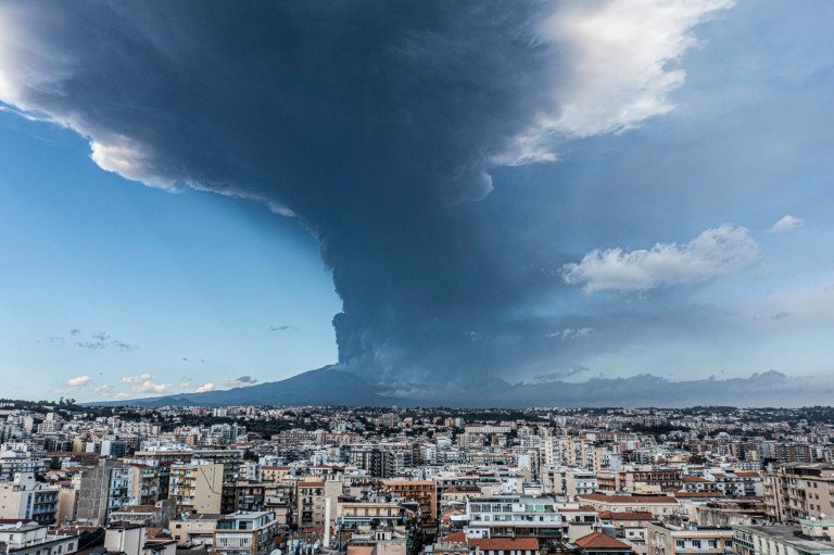 Mount Etna erupts sending six mile ash cloud into the sky and closing airport