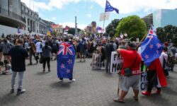 New Zealand virus cases spike as anti-vaccine protesters claim win