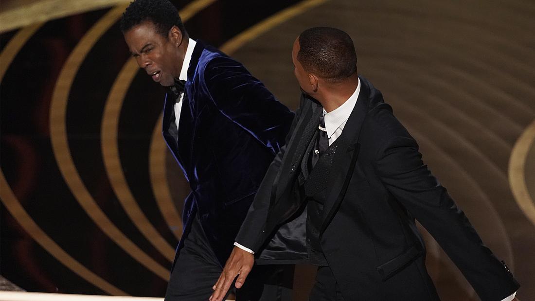 Will Smith punches Chris Rock on stage - Oscars 2022