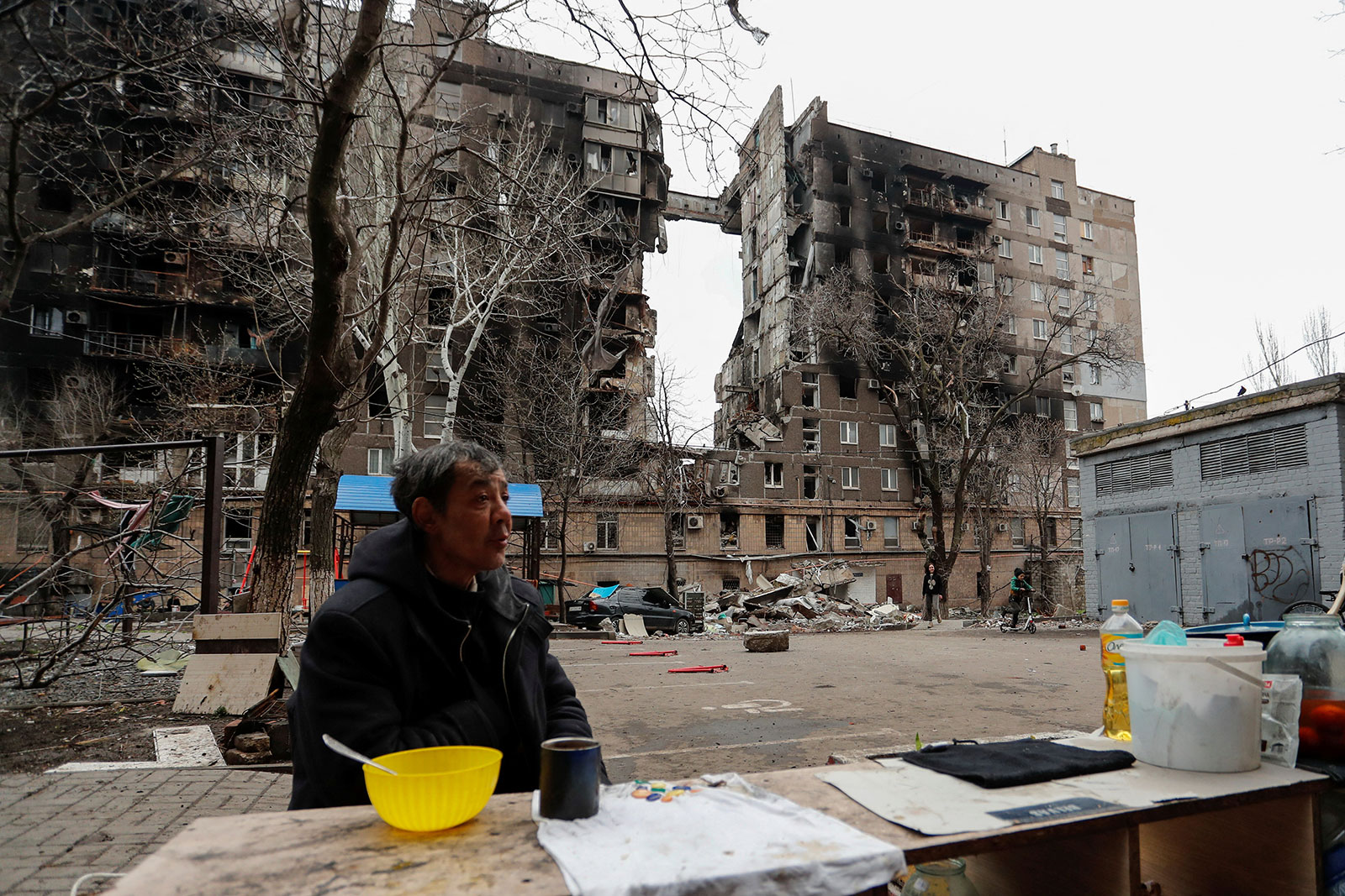 Russia gives Ukrainian forces last warning 7 hours to surrender or else as a man sits outside what used to be his home