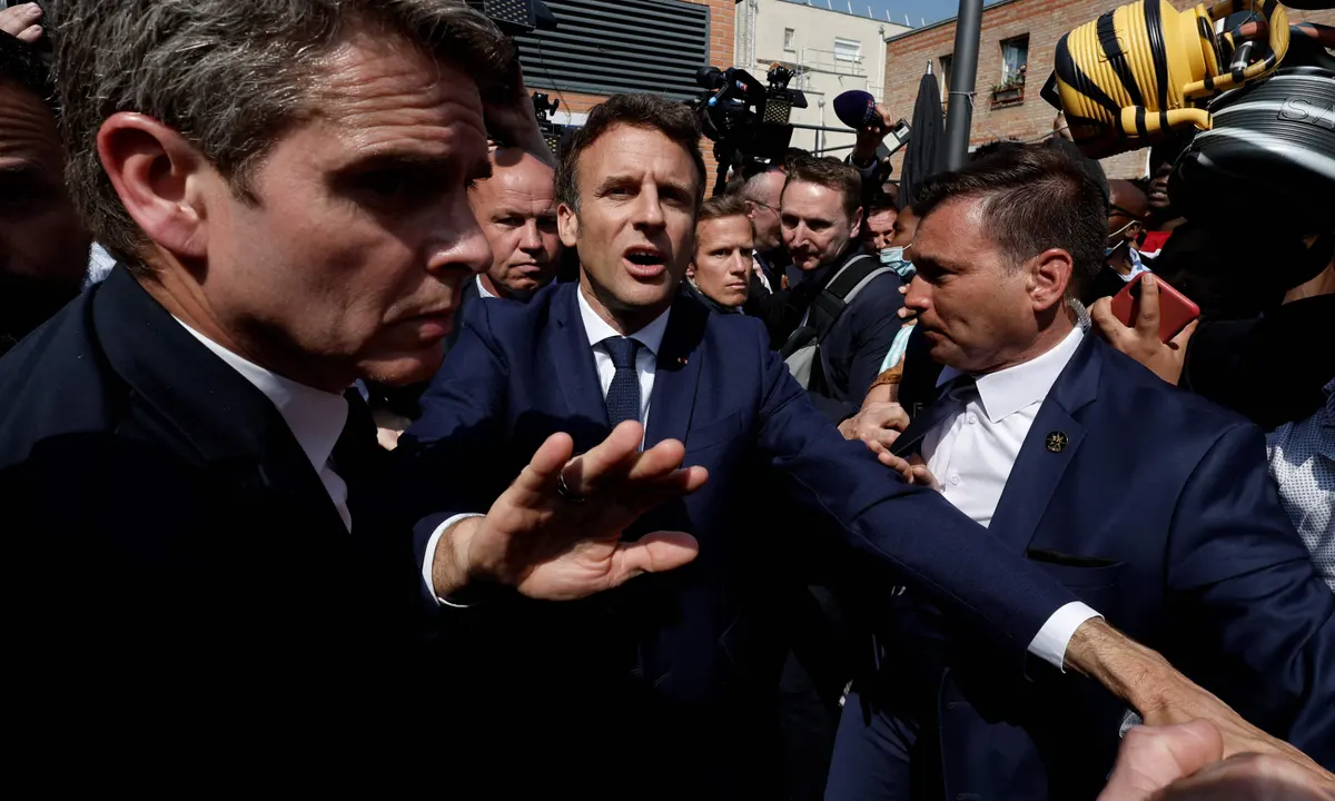 Macron dodges tomatoes in post-election walkabout