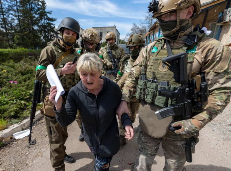 TRAITOR IN THE VILLAGE Dramatic moment special forces swooped on Ukrainian woman accused of helping Russian invaders