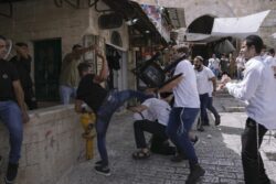 Israel defends decision to hold march marked by racism and violence