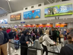 Travellers hit by MORE holiday hell as crowds face hours of queues snaking outside airport