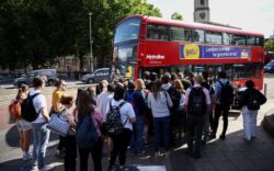 People waiting for a bus due to the Train strike today set to cause widespread travel disruption
