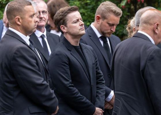 Declan Donnelly carries brother Dermott's coffin into church ahead of funeral