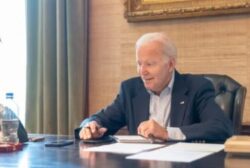 Joe Biden, 79, shares smiling photo from his desk as he fights Covid the day after revealing cancer diagnosis