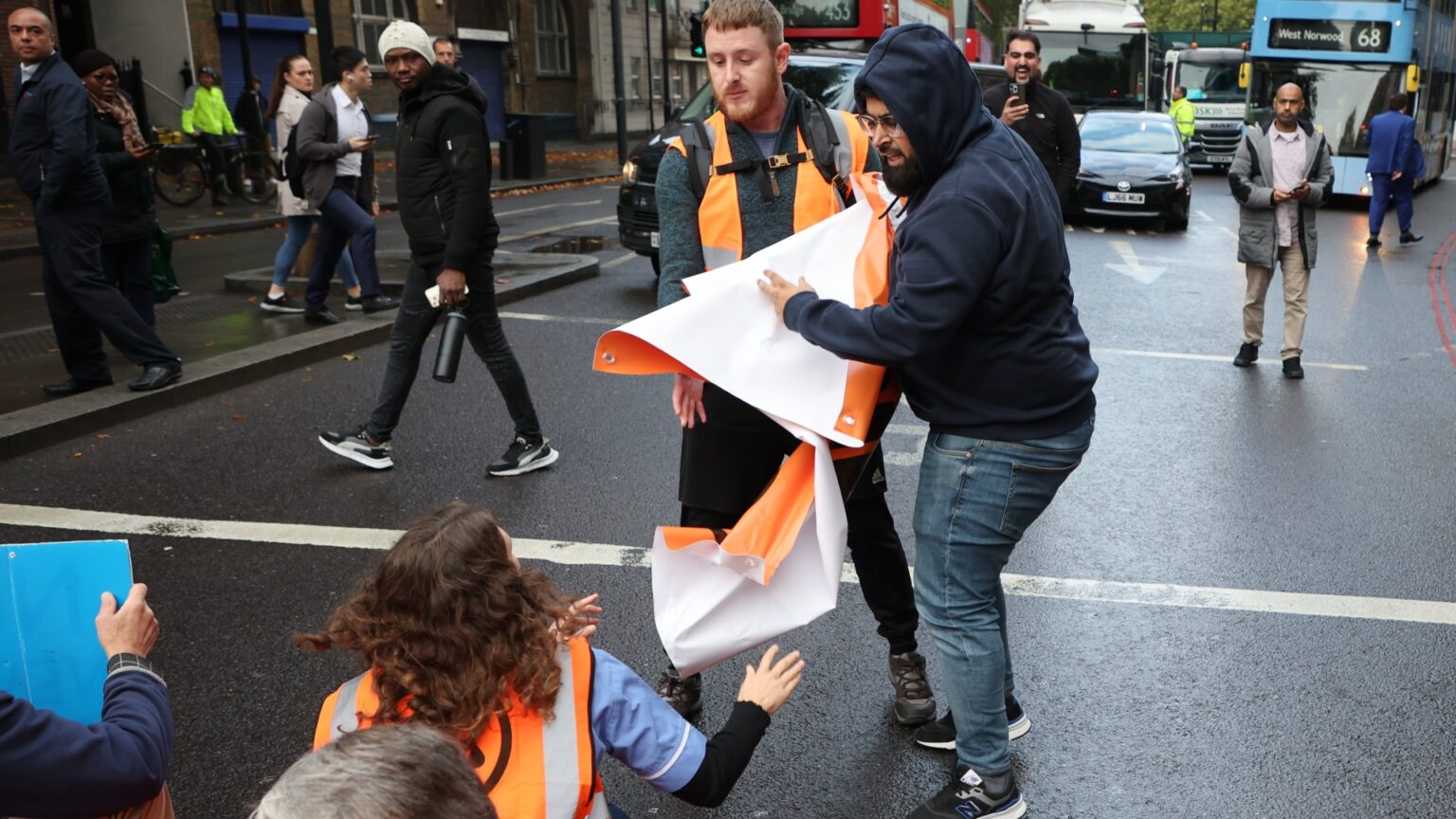 Drivers confront idiot activists after roundabout blocked & ambulance delayed