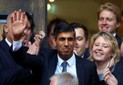 Rishi Sunak cheered outside Tory headquarters after being named new PM