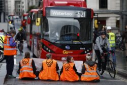 Just Stop Oil protesters create human barricade across busy London junction