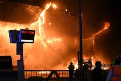 Massive fire rips through bus station and destroys vehicles