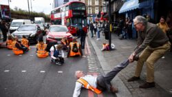 Motorists clash with eco protesters after they block fire engine & cause chaos