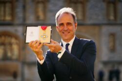 Anthony Horowitz calls for investment in school libraries as he receives CBE