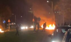 Dundee in flames as youths smash cars with bricks and hurl fireworks into the street