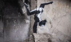 Elusive artist Banksy reveals mural of handstanding gymnast in devastated Ukraine town