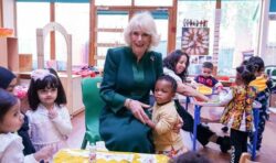 Camilla’s cheeky moment with young boy while giving out Paddington bears at Bow nursery